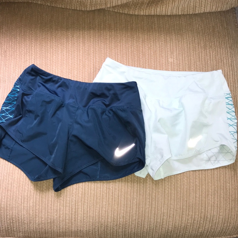 Two blue Nike small shorts